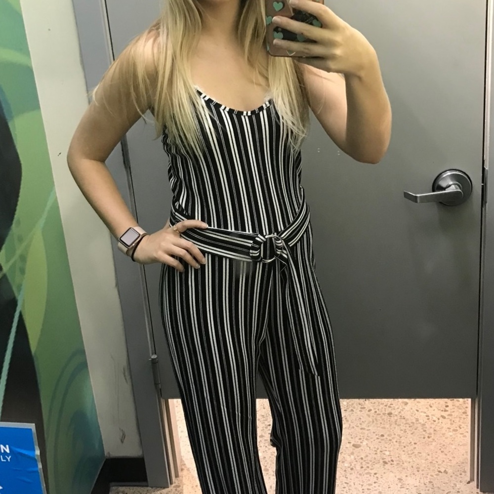 Black and White striped jumpsuit. Size small/medium